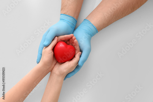 Hands of doctor and patient...