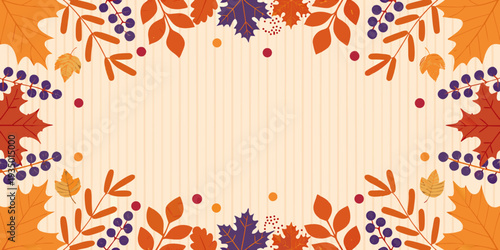 Autumnal frame with colorful leaves and berry branches on a striped background