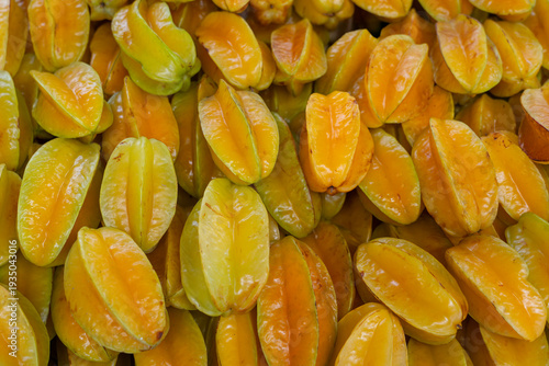 close up on fresh starfruit carambola stacking in the market