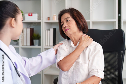 Wallpaper Mural Compassionate Doctor. Nurse providing care to elderly patient with shoulder pain. Torontodigital.ca
