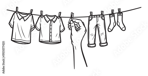 Hand placing laundry on an outdoor clothesline with shirts, pants, and socks, symbolizing household chores and sustainable living for lifestyle and domestic projects