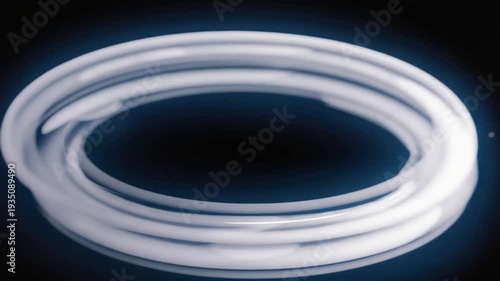Glowing white neon light forming circular motion in dark space