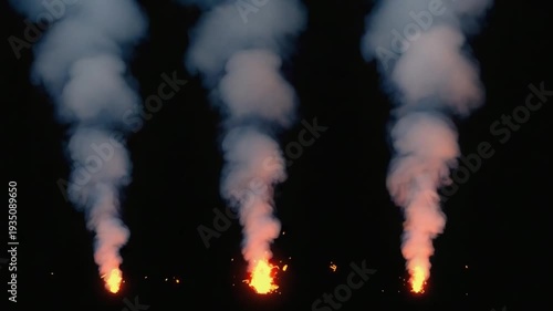 Vibrant flames with thick smoke rising against dark background