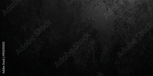 A dark textured background with subtle gradients and a grainy appearance offering a versatile backdrop for designs