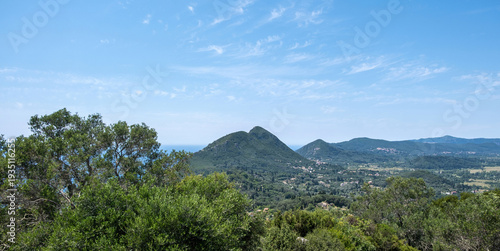 View from Kaiser’s Throne over Corfu island hills, Greece. Villages and distant ionian sea, blue sky