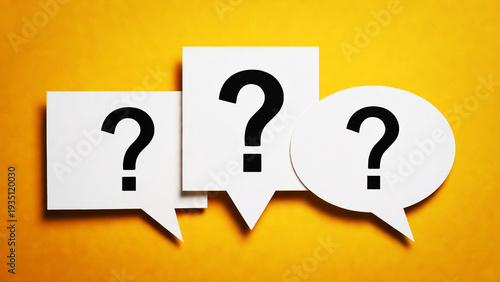 White Speech Bubbles with Black Question Marks on Yellow Background, Representing Curiosity and Inquiry