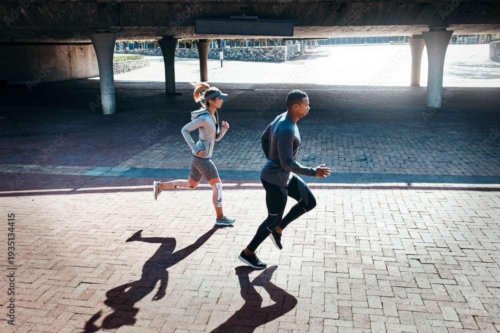 Fototapeta premium Running, fitness and couple in city with workout, health or training for marathon together. Sports, wellness and man with woman for cardio exercise, active or challenge in urban town for race.
