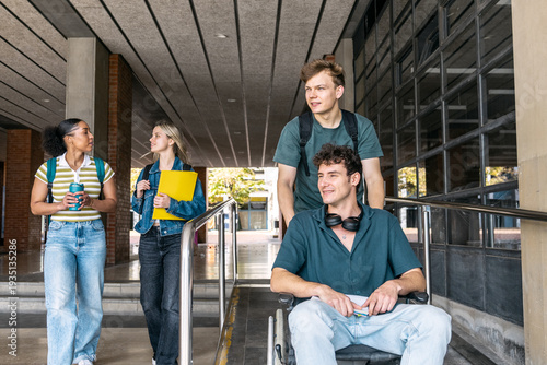 Fotografía Group of diverse college students walking and using an accessibility ramp for in