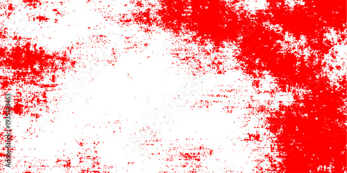 A textured red grunge backdrop featuring artistic paint splashes and ink splatters in a vector illustration pattern perfect for a dirty crimson wallpaper or festive Christmas card design