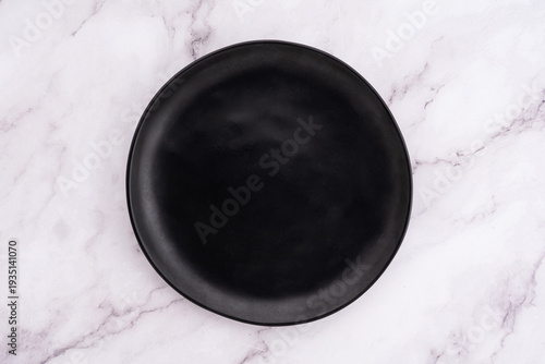 Black Rounded Ceramic Plate Marble Background