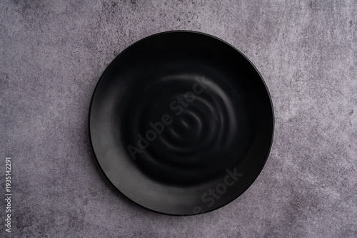 Black Rounded Ceramic Plate Marble Background