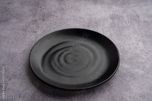 Black Rounded Ceramic Plate Marble Background