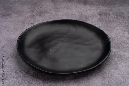 Black Rounded Ceramic Plate Marble Background
