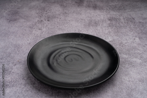 Black Rounded Ceramic Plate Marble Background