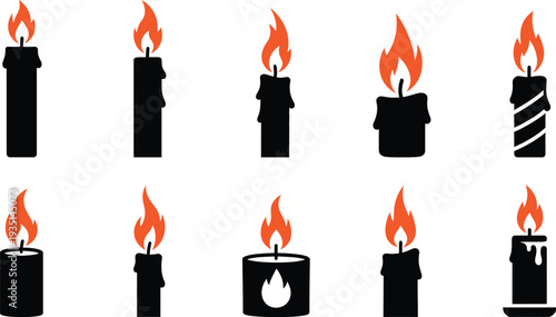 Collection of burning candles in various states and designs