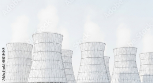 Cooling towers at a power plant emitting steam into the sky.