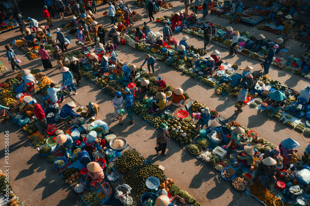 Fototapeta premium Aerial view of busy local daily life of the morning local market in Vi Thanh or Chom Hom market, Mekong Delta, Vietnam.