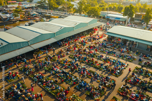 Aerial view of busy local daily life of the morning local market in Vi Thanh or Chom Hom market, Mekong Delta, Vietnam.