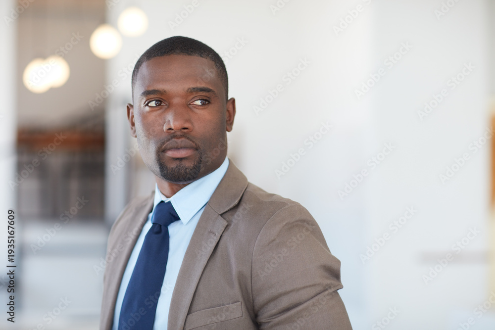 Fototapeta premium Ambitious, employee and man in office, thinking and planning for financial growth, ideas or serious. Business, investment banker and black person with decision for funding opportunity and reflection