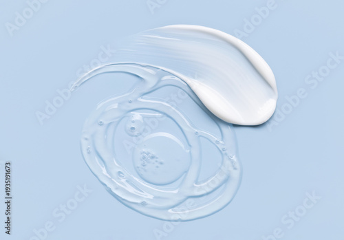 Foto samples of cosmetic care products smear of cream and gel texture on a light blue