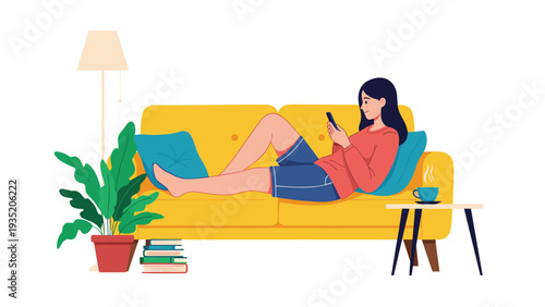 Young woman relaxes by lying on a bright yellow sofa while looking at her new smartphone in a cozy living room.