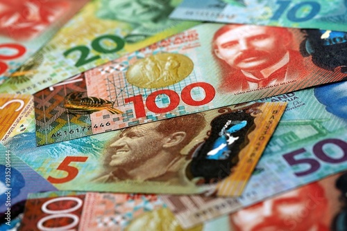 Wallpaper Mural New Zealand dollar money bills pile on table. New Zealand banknotes of NZD currency close up. Torontodigital.ca