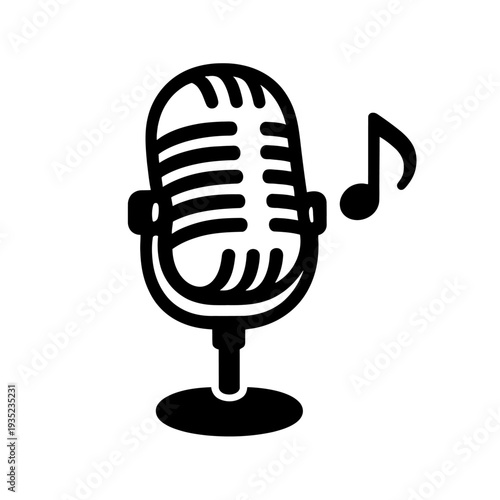 A sleek microphone stands alone in a dark studio environment