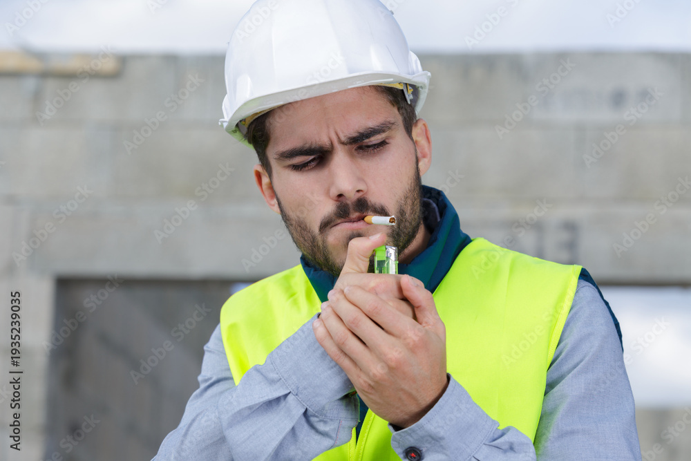 © auremar - a craftsman is smoking outdoors © auremar - a craftsman is smoking outdoors