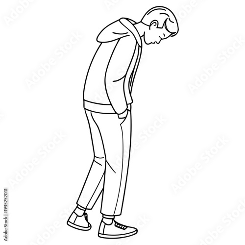 Young person standing with head bowed downward.