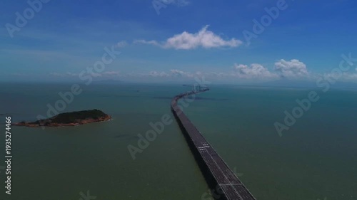 Wallpaper Mural Stunning aerial footage of Zhuhai showcasing modern CBD skyline, bustling harbor, and the magnificent Hong Kong-Zhuhai-Macao Bridge spanning across the blue South China Sea. Torontodigital.ca
