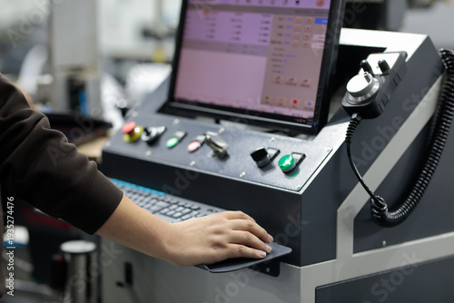Quadro su tela operator working with computerized equipment