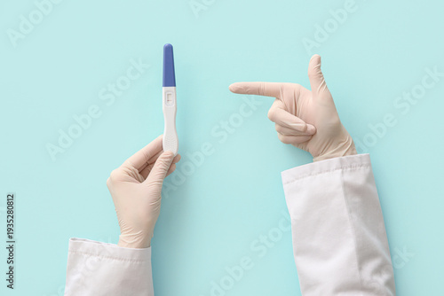 Female doctor's hands point...
