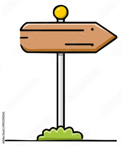Wooden directional signpost with a yellow topper and green grass at the base