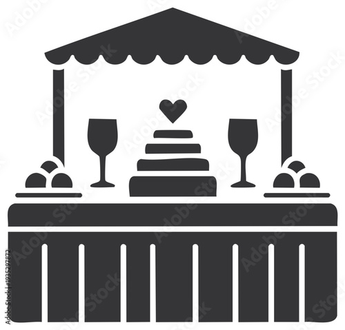 Wedding reception table with cake and wine glasses