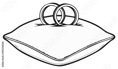Wedding rings on a pillow, symbol of marriage and love in black and white.