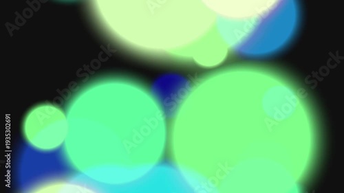 Blurry Green Blue Circles on Black Background.
