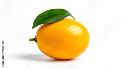 Close-up of a perfectly ripe, single yellow fruit with a vibrant green leaf