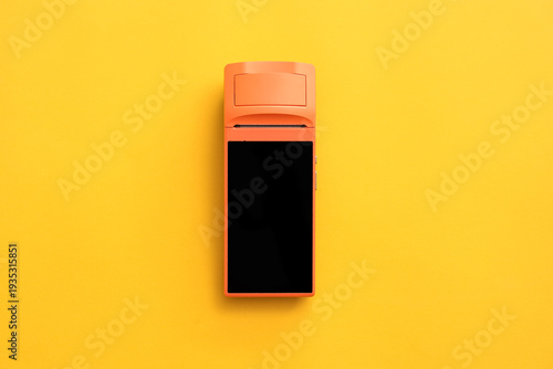 Payment terminal on yellow ...