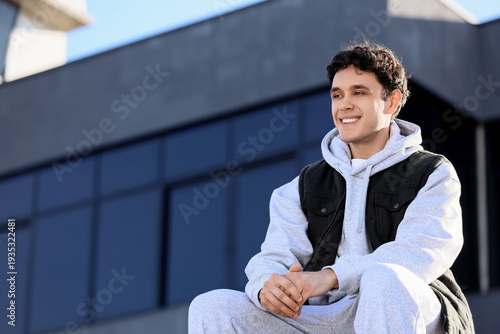 Young man in sports suit wi...
