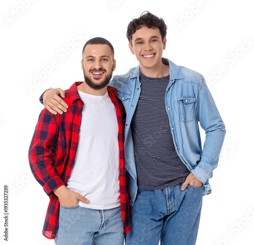 Male friends hugging on whi...