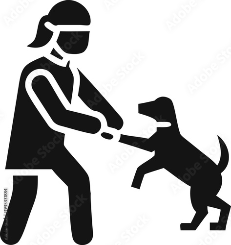 Joyful person plays with their happy dog outdoors, engaging in active and fun interaction