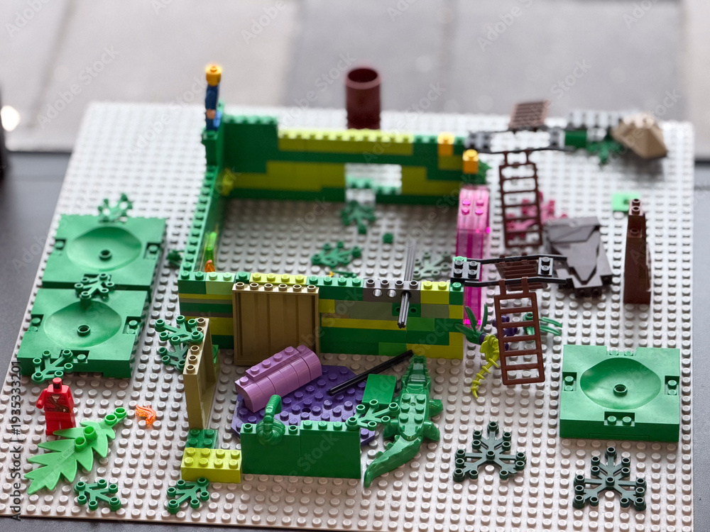 Fototapeta premium Colorful toy brick playset on baseplate