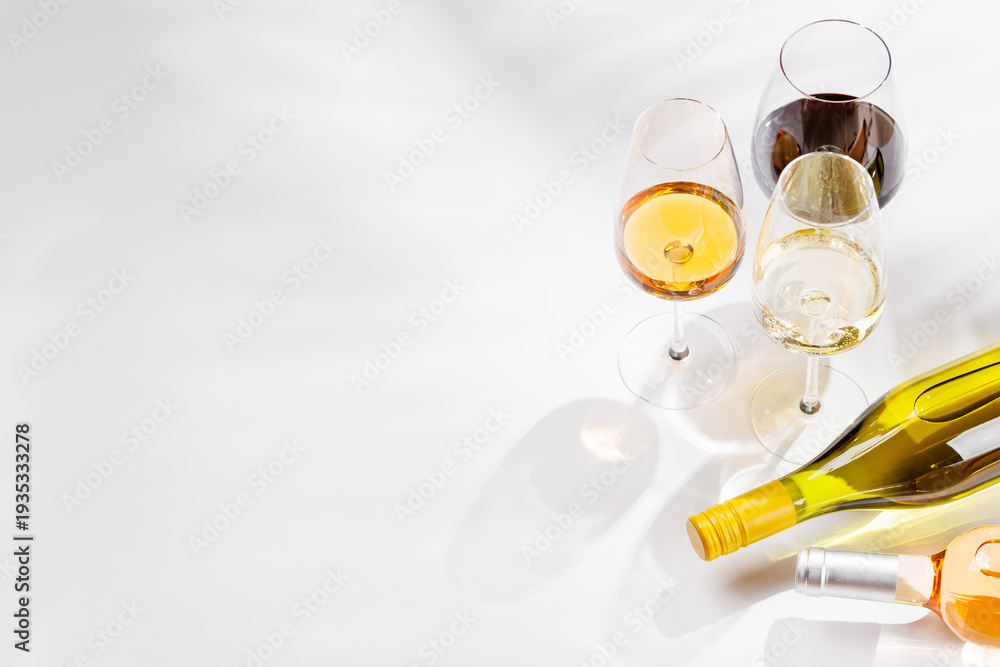 Naklejka premium Different wine glasses on white background