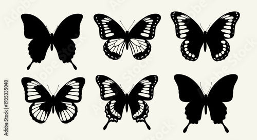 Collection of black and white butterfly silhouettes on a plain background.