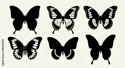 Set of black butterfly silhouettes with varying wing patterns.