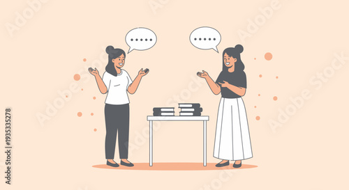 Two women having a conversation while standing near a table with books.