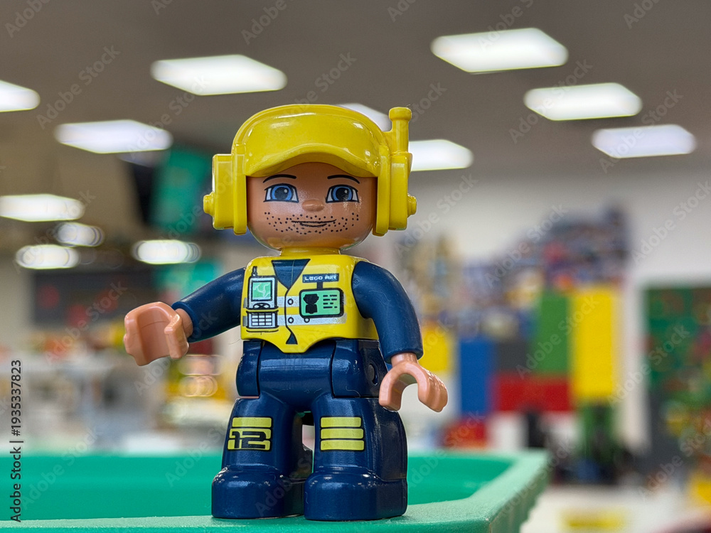 Fototapeta premium Lego-style construction worker minifigure close-up