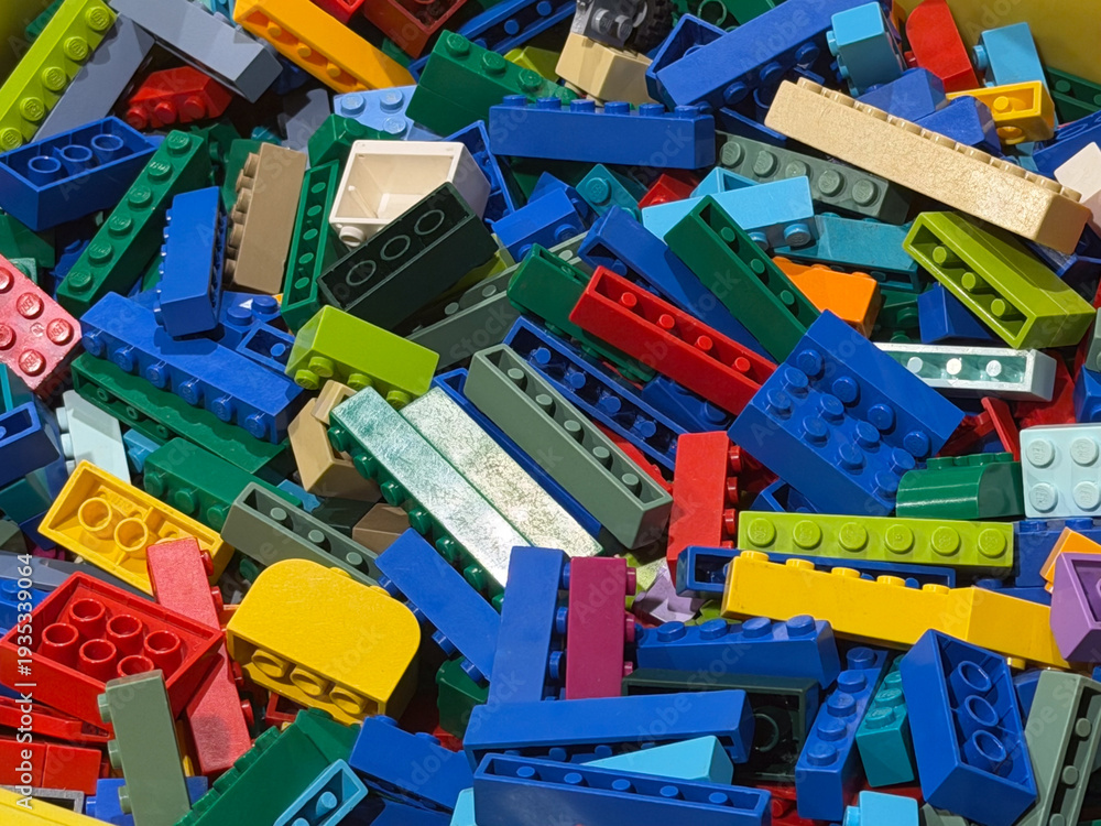 Fototapeta premium Colorful pile of plastic building bricks