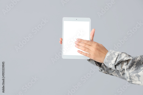 Female soldier's hands with...