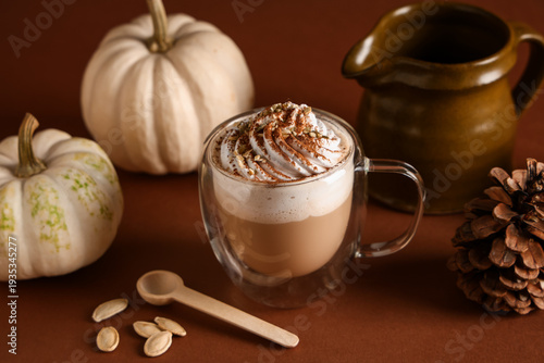 Glass cup of hot pumpkin la...